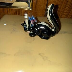 Black and White Ceramic Skunk Figurine with Blue Bow